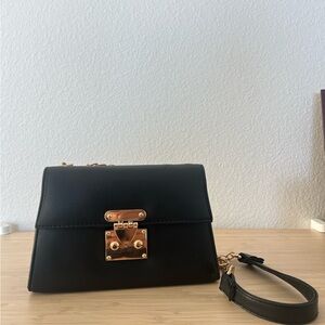 Elegant Black Handbag with Gold Accents